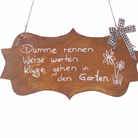 Garden decoration rust sign with saying "Stupid run wise wait wise go into the garden"